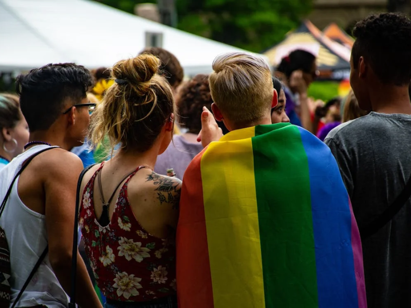 people with rainbow flag